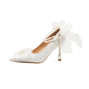 Elegant white French style bridal high heels with pearl strap and bow detail
