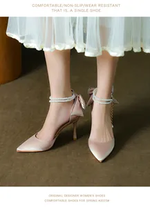 Elegant pointed toe stiletto pumps with pearl ankle strap and bow detail in satin finish