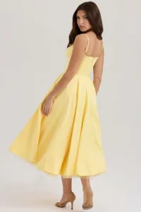 Detailed back view of a yellow French-style corset waist midi dress with mesh hem.