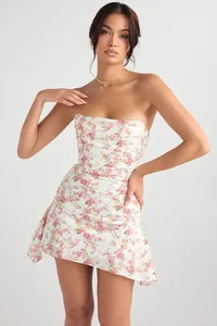 Close-up of French style floral strapless bodycon mini dress with asymmetrical hem