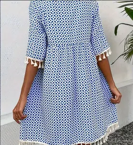 Bohemian blue and white geometric print mini dress with elegant tassel fringe details