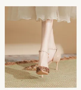 Elegant sequined ankle strap high heel sandals with pointy toe and stiletto heels in detail view