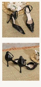 Close-up of elegant black sequined pointed-toe pumps with ankle strap and stiletto heel