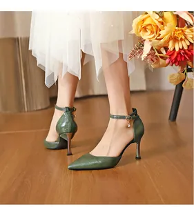 Elegant green crocodile pattern pointed-toe stiletto heels with dainty ankle strap charm