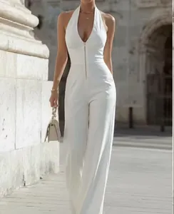 Elegant white sleeveless halter jumpsuit with front zipper detail for women.