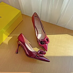 Elegant wine red patent leather pointed toe stiletto heels with stylish chain detail decoration