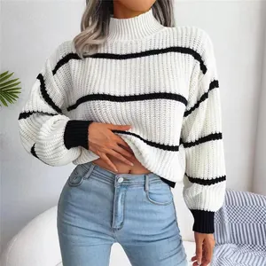 Detail shot of the knit texture on this striped mock neck sweater with lantern sleeves