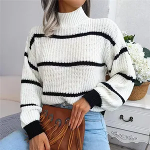 Detailed macro view of white and black striped knit sweater with lantern sleeves