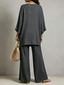 Back view of a relaxed charcoal grey linen-blend two-piece set with wide-leg pants