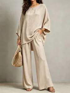 Full view of elegant beige cotton linen two-piece set with oversized top and wide pants