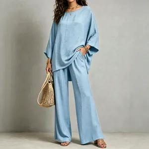 Elegant light blue linen-cotton two-piece set with oversized top and wide-leg pants