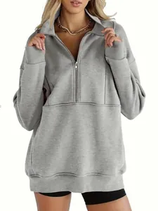 Close-up of gray half-zip fleece sweatshirt showing collar and stitching details