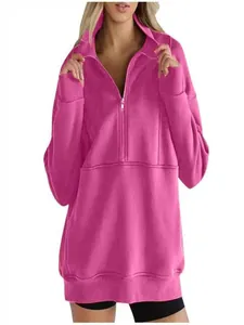 Close-up detail of the pink half-zip fleece pullover showing zipper and collar
