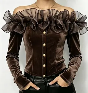 Detail showing the elegant ruffled organza trim and gold buttons on a brown velvet top