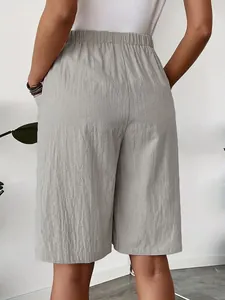 Back view of high quality women's grey casual wide-leg shorts with elastic waist and pockets