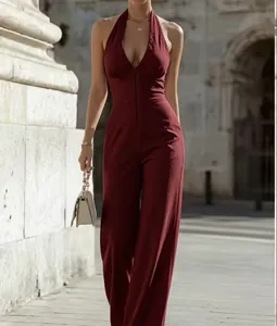 Detail view of an elegant burgundy halter neck jumpsuit with a front zipper closure.