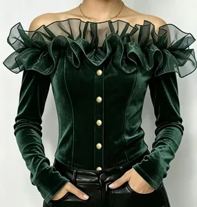 Detail showing dark green velvet off-shoulder shirt with ruffled organza neckline