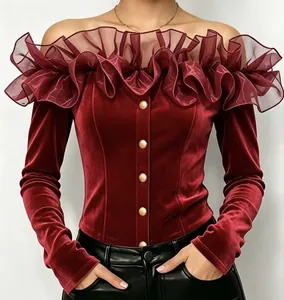 Close-up of wine red velvet off-shoulder blouse with ruffled organza floral collar