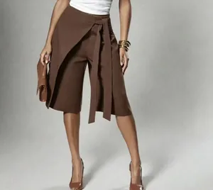 Detail view of brown wrap-tie wide-leg culottes for a sophisticated commuter look