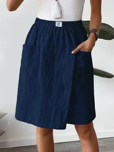 Detail view of navy blue casual pocket skorts for women with elastic waist