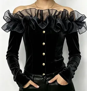 Elegant black velvet off-the-shoulder blouse featuring sheer ruffle collar and gold buttons