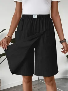 Detail view of women's black casual skort showing the split skirt-front design