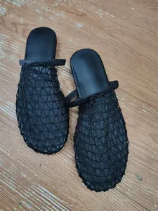 Detailed view of black mesh woven hollow-out flat mules for women summer vacation