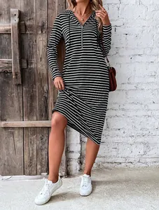 Detail view of the striped hooded dress with a half-zipper neckline and long sleeves