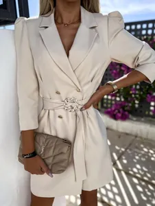 Elegant beige belted blazer dress with puff sleeves and circular pearl buckle.