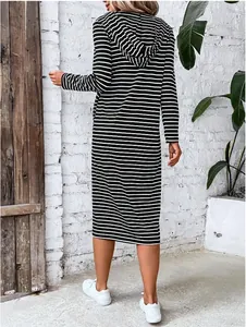 Back view of a long-sleeved black and white striped hooded midi dress for women