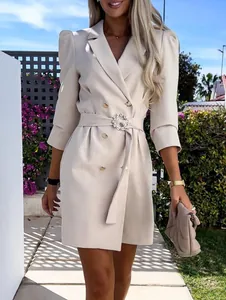 Elegant beige double-breasted blazer dress with a decorative sparkling belt buckle detail