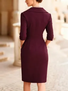 Rear view of elegant burgundy slim fit midi dress with wide collar and 3/4 sleeves.