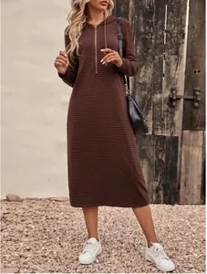 Casual autumn striped hooded slim long sleeve midi dress shown in a rustic setting.