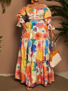 Full length view of vibrant floral tiered maxi skirt and matching off-shoulder crop top
