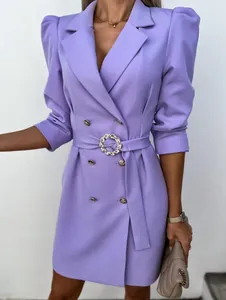 Close-up detail of lavender puff sleeve blazer dress with sparkling crystal buckle