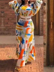 Detailed full-body shot of colorful abstract print set with cropped top and maxi skirt.