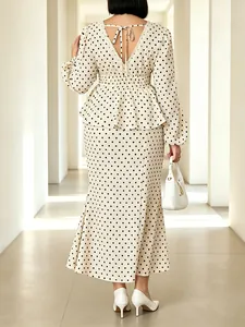 Elegant cream polka dot V-neck top and mermaid skirt set shown from the back view