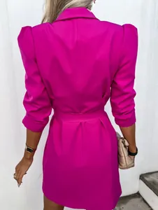 Back view of a fuchsia puff sleeve blazer dress with a stylish waist belt detail