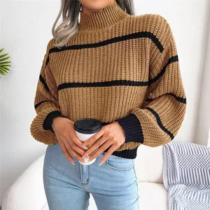 Detail of women's chunky knit striped sweater with mock neck and lantern sleeves