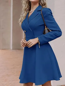 Elegant blue double-breasted long-sleeve blazer dress for women shown from a side angle