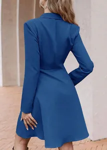 Rear view of elegant blue long sleeve double breasted coat dress showing waist fit.
