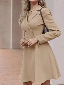 Detailed view of women's solid color double-breasted long sleeve blazer dress coat