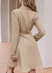 Elegant back view of a solid tan long sleeve double-breasted blazer dress for women