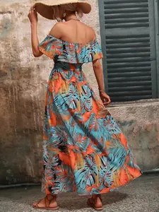 Detailed back view of tropical leaf print off-shoulder maxi dress with ruffle trim