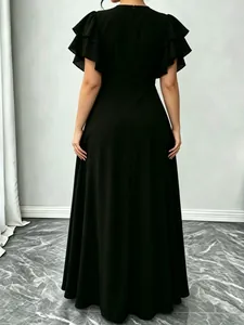 Back view of an elegant black maxi dress with tiered ruffle sleeves and a waist-cinching fit.