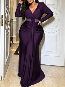 Elegant plus-size V-neck purple maxi dress with waist ruching and belt details.