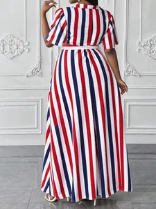 Back view of a red, blue, and white striped polo collar maxi dress with waist belt