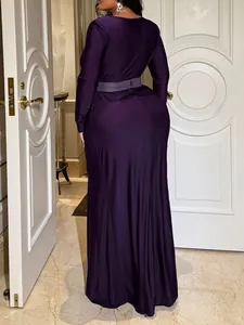 Elegant deep purple long-sleeved maxi dress with belt, back view detail