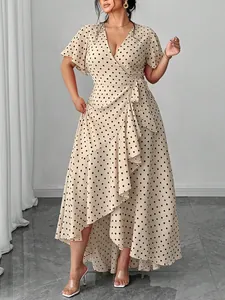 Detail of a plus size V-neck polka dot wrap dress with ruffled high-low hemline