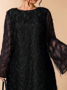 Elegant black round neck dress with shimmering textured fringe and flare sleeves